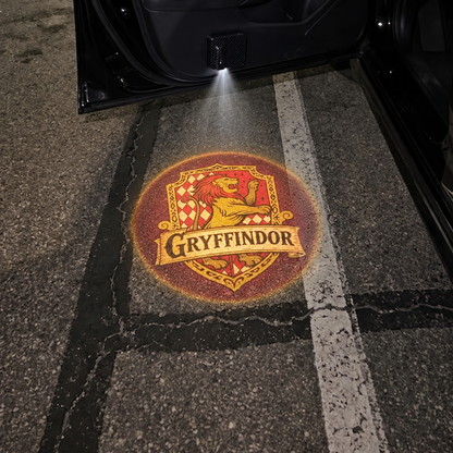 Gryffindor crest projected under car door