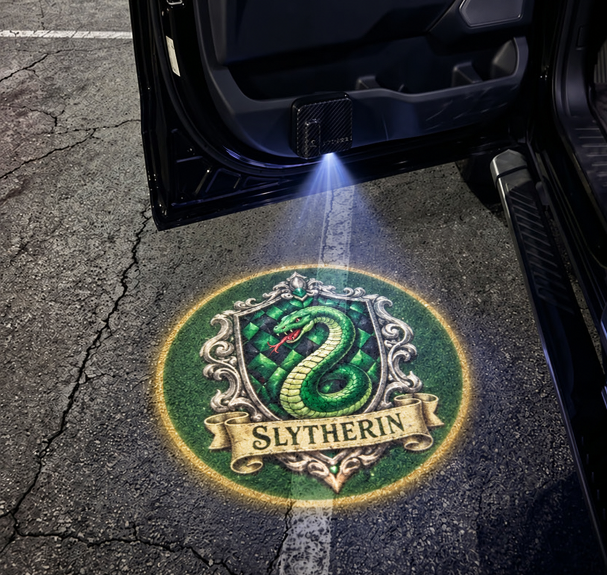 Slytherin crest projected under car door